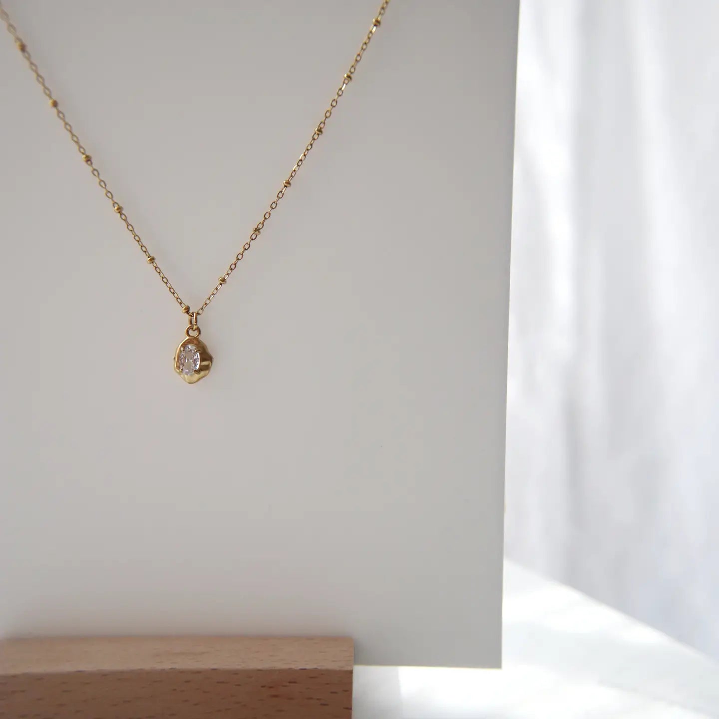 Raina Pebble Gold Plated Necklace.